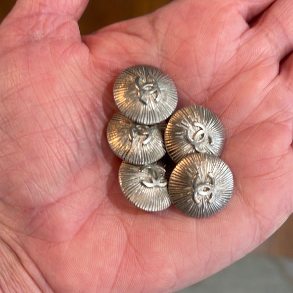CHANEL Jewelry - Authentic Chanel set of five silver starburst buttons.